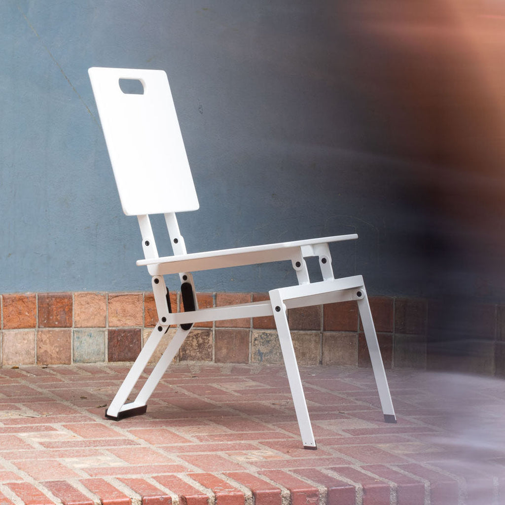 Modern Folding Chair in front of blue wall