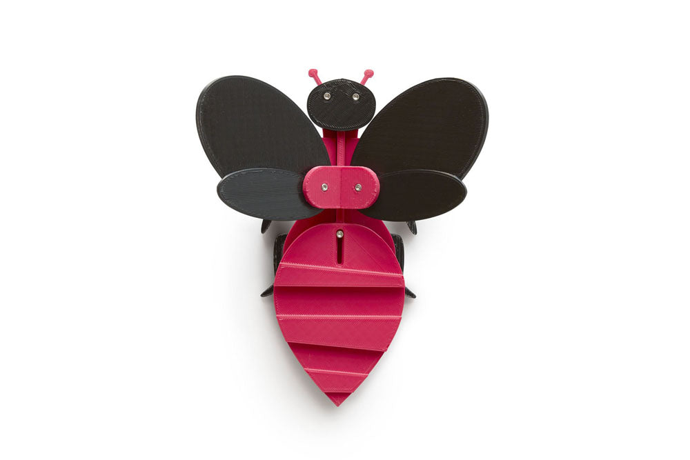 magenta and black toy bee flapping